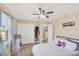 Comfortable bedroom with lots of storage space, large windows, and a ceiling fan at 6264 Drucker Cir, Port Charlotte, FL 33981