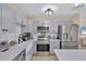 Well-equipped kitchen featuring stainless steel appliances, modern countertops, and plenty of cabinet space at 6264 Drucker Cir, Port Charlotte, FL 33981