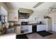 Functional kitchen featuring white cabinets, updated appliances, and ample counter space at 6264 Drucker Cir, Port Charlotte, FL 33981