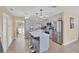 Bright kitchen featuring stainless steel appliances, updated countertops, and a convenient island with barstool seating at 6264 Drucker Cir, Port Charlotte, FL 33981