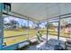 Screened in lanai featuring views of the lush green backyard at 6264 Drucker Cir, Port Charlotte, FL 33981