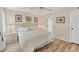 Comfortable bedroom featuring a bed, nightstands, and tasteful decor at 6699 San Casa Dr # Q3, Englewood, FL 34224