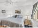Comfortable bedroom with soft lighting, neutral color palette, and a view of the window and natural light at 6699 San Casa Dr # Q3, Englewood, FL 34224