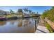 Scenic view from the private boat dock showcasing beautiful reflections on the calm canal waters at 6699 San Casa Dr # Q3, Englewood, FL 34224