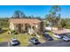 Inviting two-story building featuring tan and brown accents, tidy landscaping, and ample parking at 6699 San Casa Dr # Q3, Englewood, FL 34224