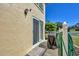 Exterior view of the home showing a sliding glass door, patio and grill at 6699 San Casa Dr # Q3, Englewood, FL 34224