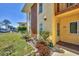 Condo exterior with neat landscaping, bright flowers and a welcoming entrance at 6699 San Casa Dr # Q3, Englewood, FL 34224