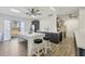 Open-concept kitchen features stainless steel appliances, a spacious island, and sleek, modern cabinetry at 6699 San Casa Dr # Q3, Englewood, FL 34224