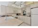 Bright kitchen featuring white cabinets, modern appliances, and ample counter space at 6699 San Casa Dr # Q3, Englewood, FL 34224