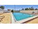 Community pool with clear blue water is ready for lounging and swimming at 6699 San Casa Dr # Q3, Englewood, FL 34224