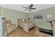 Comfortable bedroom with a ceiling fan and natural light at 6796 Gasparilla Pines Blvd # 40, Englewood, FL 34224