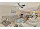 Living room with vaulted ceiling, wood floors, casual seating and view to dining area at 6796 Gasparilla Pines Blvd # 40, Englewood, FL 34224