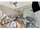 Inviting sunroom showcasing tile floors, comfortable seating, and lots of natural light at 6796 Gasparilla Pines Blvd # 40, Englewood, FL 34224