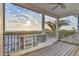 Covered balcony with ocean view, railings, ceiling fan, and unfinished screen door at 7430 Palm Island Dr # 3813, Placida, FL 33946