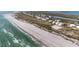 Stunning aerial view of the beach with turquoise water and white sand near waterfront houses at 7430 Palm Island Dr # 3813, Placida, FL 33946