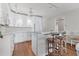 Bright kitchen boasts white cabinetry, marble countertops, stainless steel appliances, and breakfast bar seating at 7430 Palm Island Dr # 3813, Placida, FL 33946