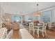 Cozy living room with hardwood floors, comfortable seating and ocean view balcony at 7430 Palm Island Dr # 3813, Placida, FL 33946