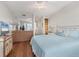 Inviting bedroom featuring hardwood floors, soft blue accents, and plenty of closet space at 7430 Palm Island Dr # 3813, Placida, FL 33946