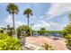 Charming outdoor patio area with grills and seating, perfect for gatherings in a tropical setting at 7430 Palm Island Dr # 3813, Placida, FL 33946