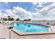 Large clear in-ground pool on a sunny day featuring ample room for lounge chairs and umbrellas at 7430 Palm Island Dr # 3813, Placida, FL 33946