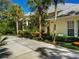 Exterior shot of home showing mature landscaping and manicured lawn at 790 N River Rd, Venice, FL 34293