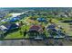 Wide aerial shot showcasing waterfront homes, canals, and lush tropical landscaping at 8264 Antwerp Cir, Port Charlotte, FL 33981