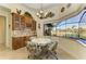 Breakfast nook showcasing views, chandelier, and a custom cabinet featuring granite countertops at 8264 Antwerp Cir, Port Charlotte, FL 33981