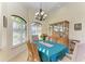 Cozy dining room features natural light from the window and a lovely chandelier over the table at 8264 Antwerp Cir, Port Charlotte, FL 33981