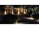 Well-maintained home with ample garage space and illuminated driveway for added security and aesthetic appeal at night at 8264 Antwerp Cir, Port Charlotte, FL 33981