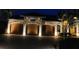 Well-maintained three-car garage with elegant lighting and a brick driveway adds curb appeal to this beautiful home at 8264 Antwerp Cir, Port Charlotte, FL 33981