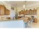 Gourmet kitchen boasts granite countertops, custom cabinets, and a breakfast bar at 8264 Antwerp Cir, Port Charlotte, FL 33981