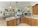 Beautiful kitchen featuring granite countertops, a breakfast bar, and stainless steel appliances at 8264 Antwerp Cir, Port Charlotte, FL 33981
