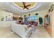 Open living room features tile flooring, tray ceilings and sliding doors at 8264 Antwerp Cir, Port Charlotte, FL 33981