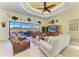 The open living room boasts tile floors, natural light, and access to the pool at 8264 Antwerp Cir, Port Charlotte, FL 33981
