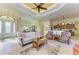 Spacious living room with tile flooring, tray ceiling, and open floor plan at 8264 Antwerp Cir, Port Charlotte, FL 33981