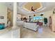 Bright living room with tile flooring, a tray ceiling, and sliding glass doors to the lanai at 8264 Antwerp Cir, Port Charlotte, FL 33981