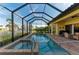 Lovely in-ground pool and spa with covered lanai and gorgeous waterfront at 8264 Antwerp Cir, Port Charlotte, FL 33981