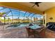 Screened in lanai features a pool, hot tub and water views at 8264 Antwerp Cir, Port Charlotte, FL 33981