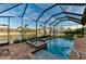 Enclosed pool and spa with beautiful brick pavers and waterfront views at 8264 Antwerp Cir, Port Charlotte, FL 33981