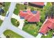 Aerial view of home with solar panels, well manicured lawn and mature landscaping at 8356 Creekview Ln, Englewood, FL 34224