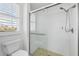Modern bathroom featuring a walk-in shower with tile surround at 8356 Creekview Ln, Englewood, FL 34224