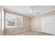 Bedroom features neutral decor and a closet at 8356 Creekview Ln, Englewood, FL 34224