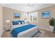 Inviting bedroom with neutral decor and a plush bed at 8356 Creekview Ln, Englewood, FL 34224