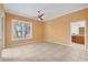 A bright bedroom featuring a ceiling fan, and ensuite bathroom at 8356 Creekview Ln, Englewood, FL 34224