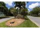 Oyster Creek community sign surrounded by lush landscaping at 8356 Creekview Ln, Englewood, FL 34224