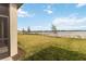 Expansive backyard leads to a serene lake, enhancing the property's appeal at 8562 Shore Lake Dr, Englewood, FL 34224