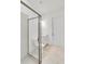 Bathroom with a walk-in shower, white vanity, and modern fixtures at 8562 Shore Lake Dr, Englewood, FL 34224