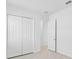 Neutral, empty bedroom with a closet at 8562 Shore Lake Dr, Englewood, FL 34224