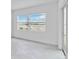 Bedroom with lake view and sliding glass door at 8562 Shore Lake Dr, Englewood, FL 34224
