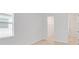 Neutral bedroom with a closet and access to the adjacent hallway at 8562 Shore Lake Dr, Englewood, FL 34224